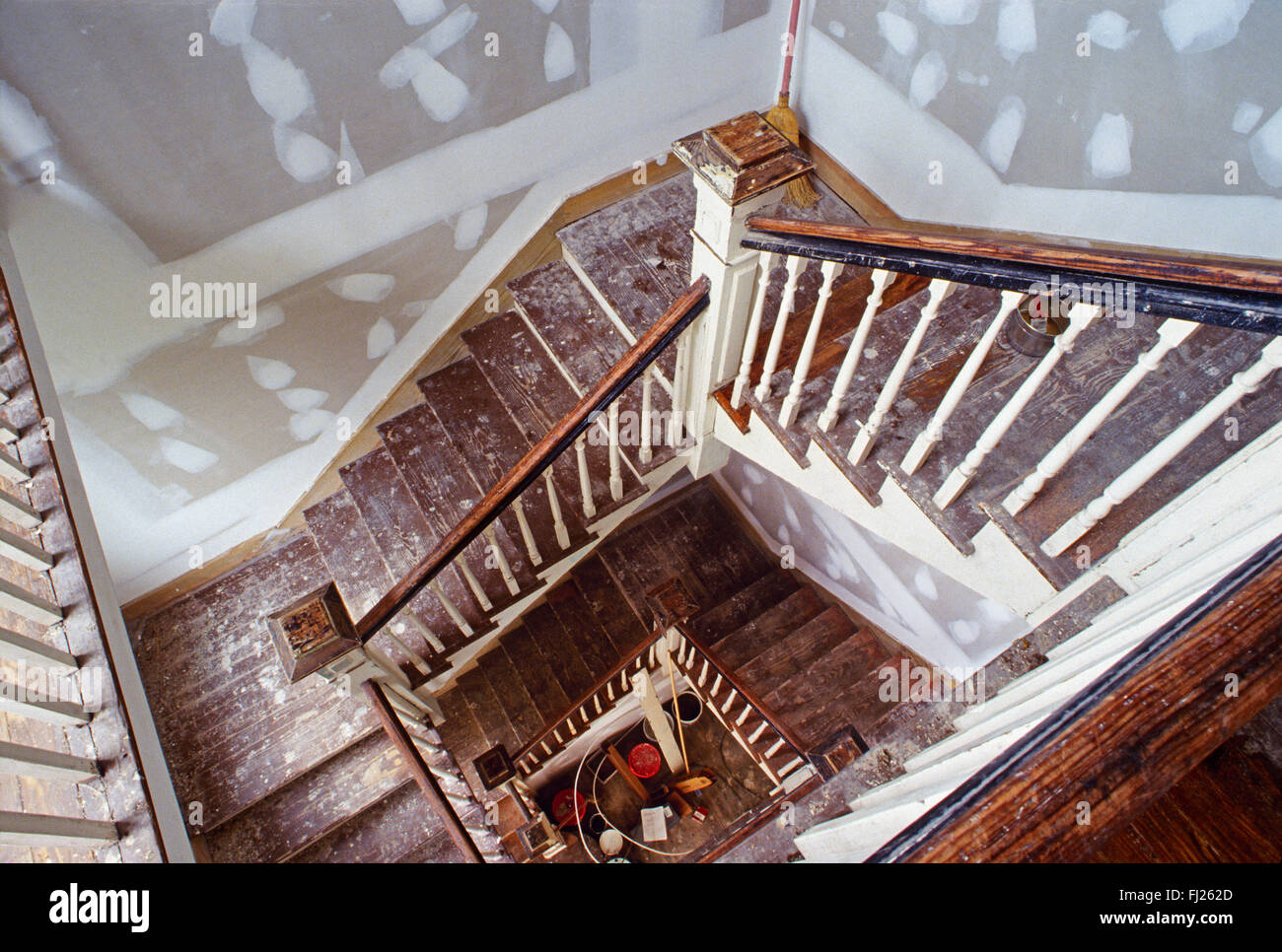 Interior grand stairwell of historic house prepared for new paint, Charleston, South Carolina, USA Stock Photo