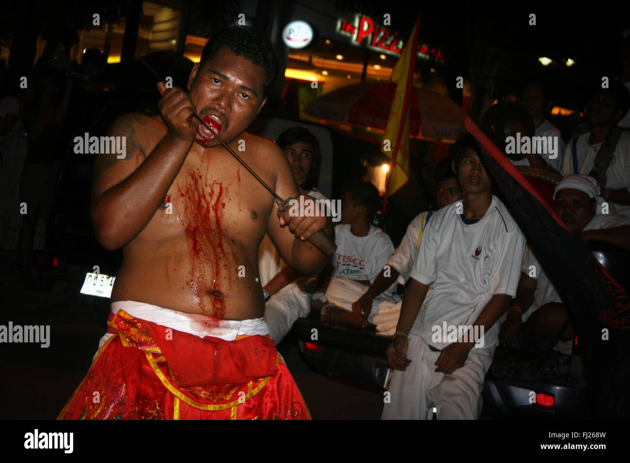 Bleeding people and procession with during traditional annual vegetarian festival in Krabi, Thailand Stock Photo