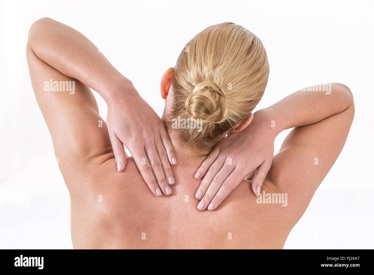 Premium Photo  Young female at spa resort receiving massage on neck and  shoulders muscles