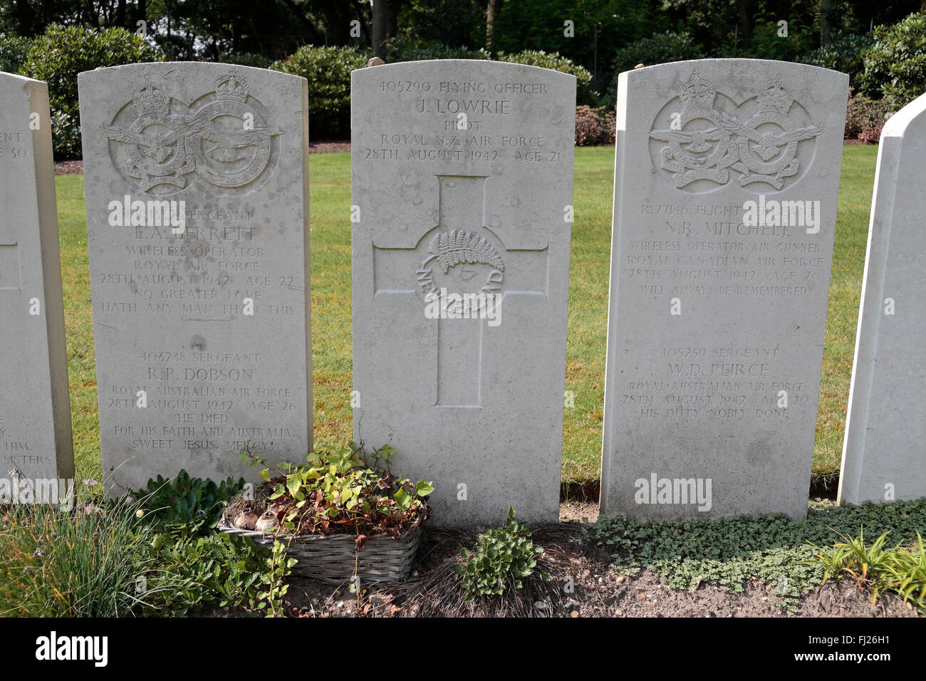 Headstones of maybe one plane crew from four nations in the CWGC Mook War Cemetery, Mook, Limburg, Netherlands. Stock Photo