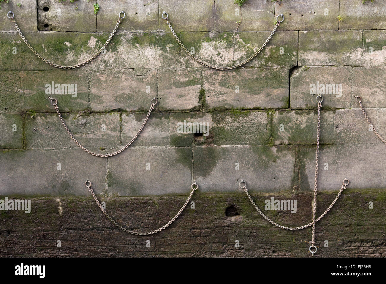 Chains hanging on a dock wall hires stock photography and images Alamy
