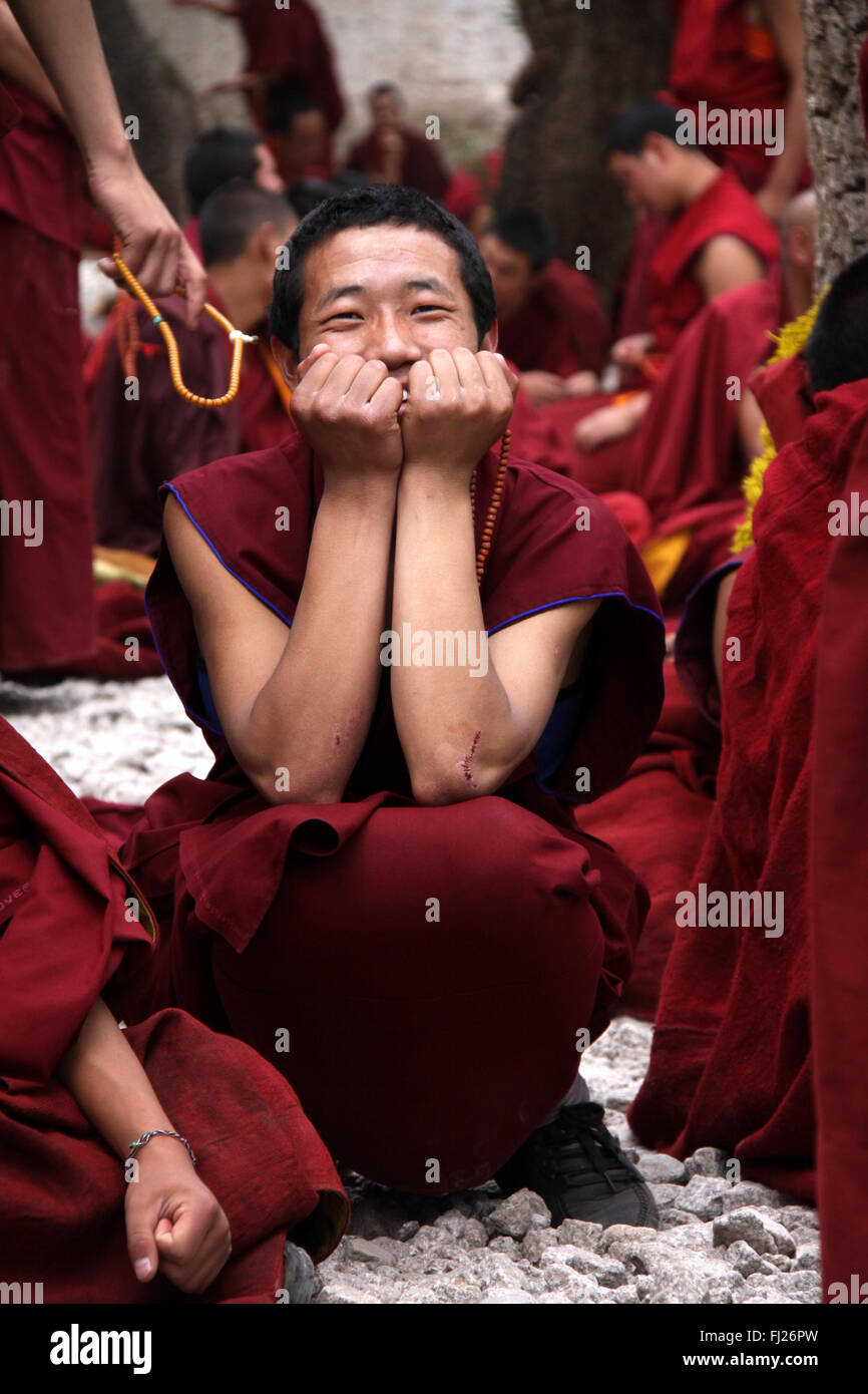 happy tibetan monk in Jonkhang temple, Lhasa Stock Photo