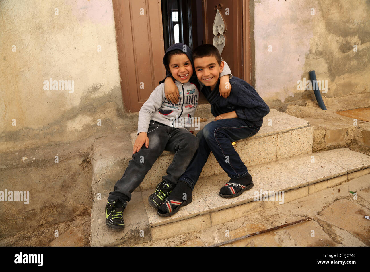 Kurdish kids at home in Mardin, Turkey Stock Photo