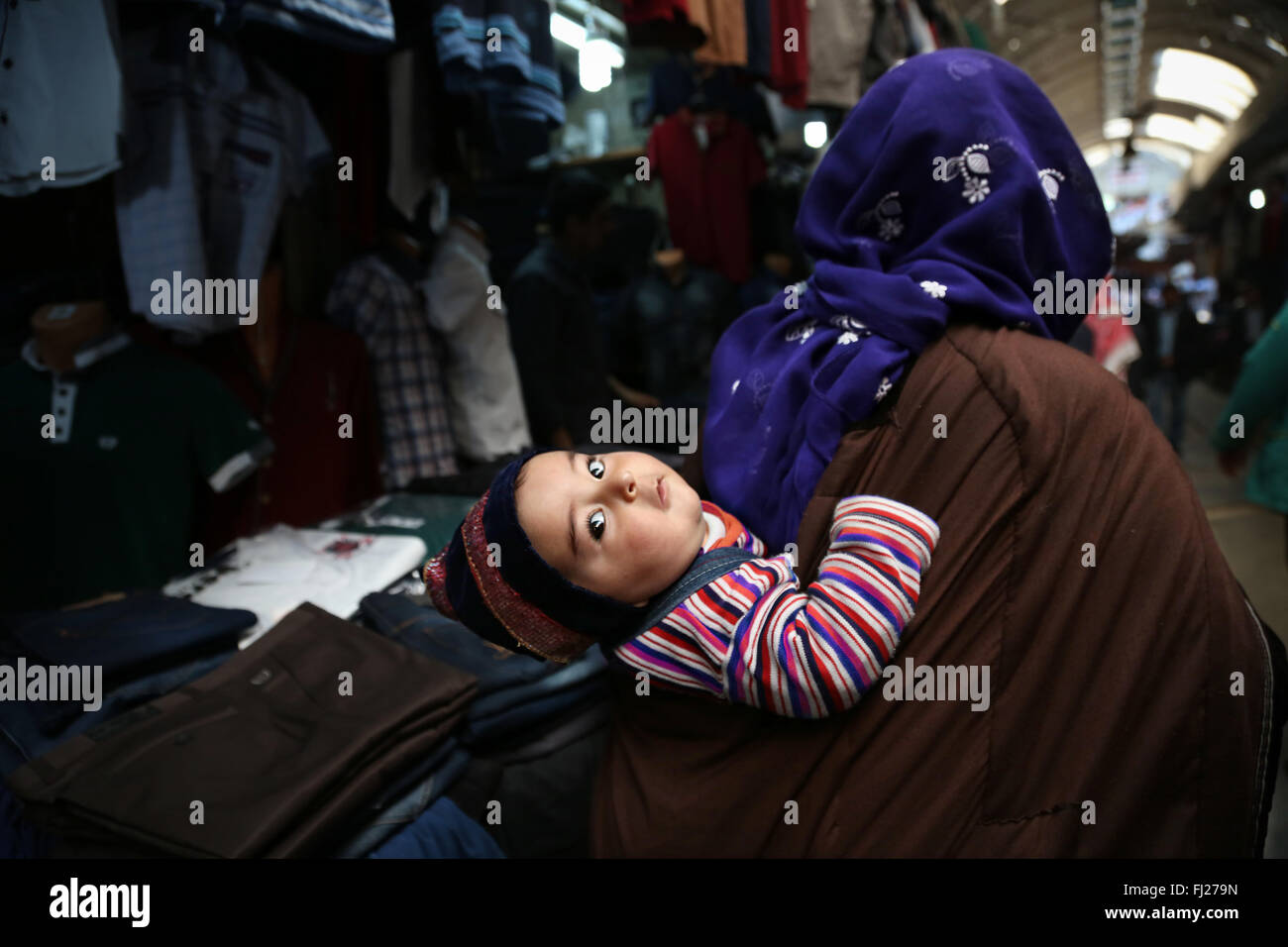 Baby in market of MArdin, Turkea Stock Photo