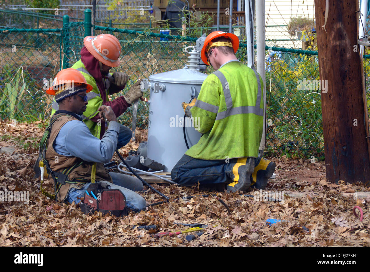 Utility Workers work on a electrical transformer Stock Photo Alamy