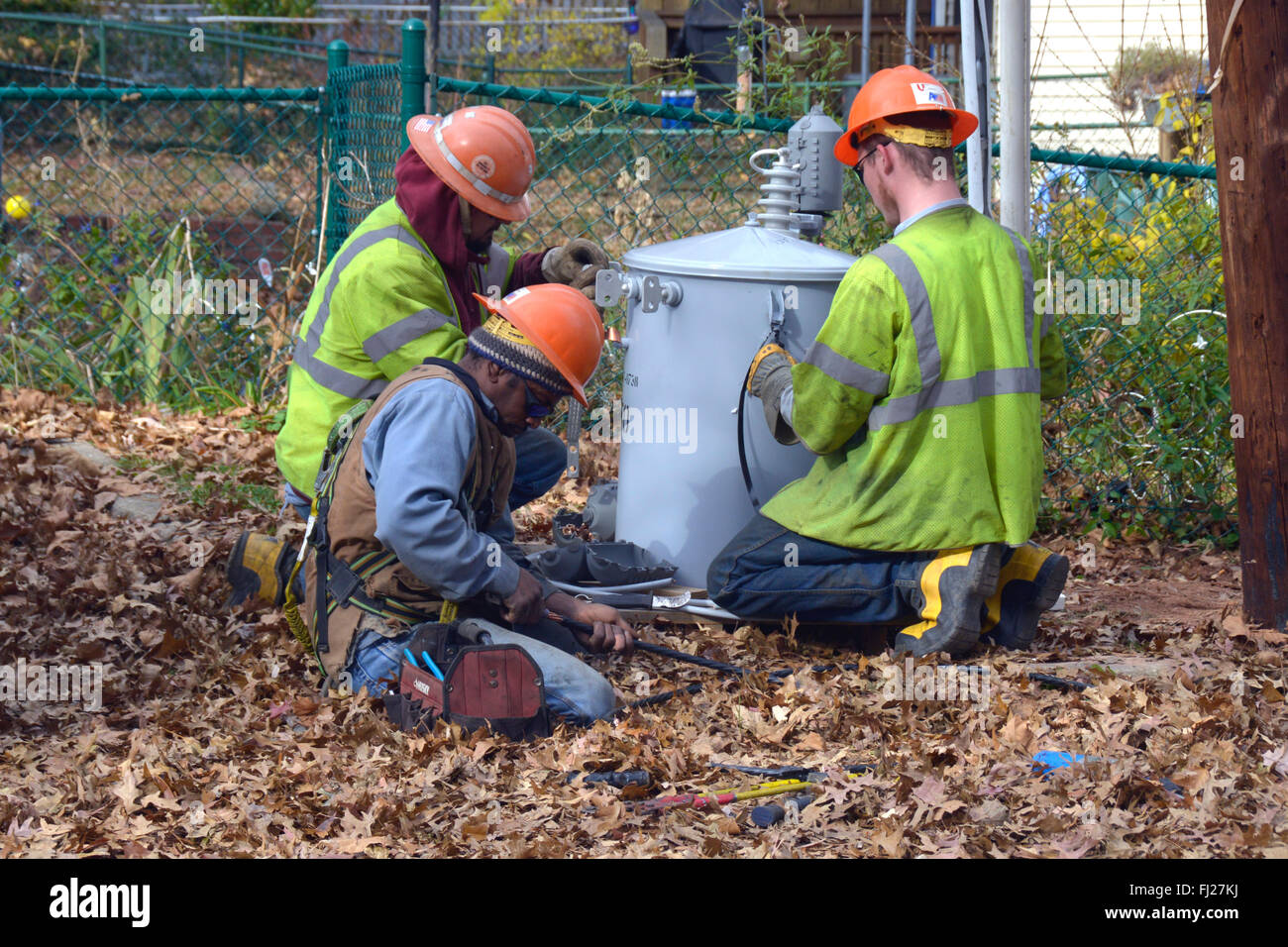 Utility Workers work on a electrical transformer Stock Photo Alamy