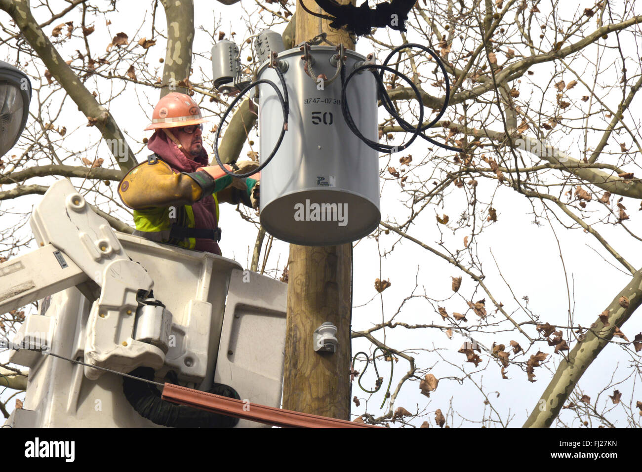 Utility worker working on a electrical transformer Stock Photo Alamy