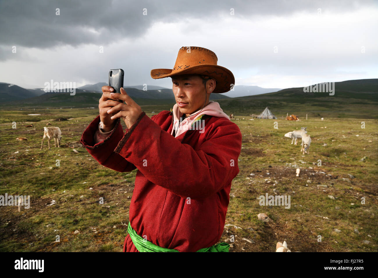 Tsaatan nomad man making selfie, Mongolia Stock Photo