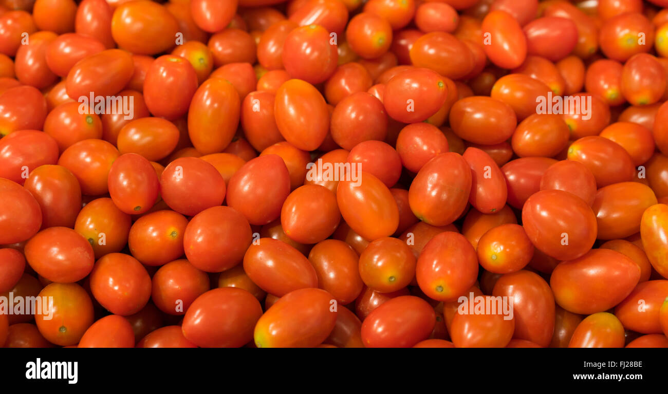 Red grape tomato background, two clipping paths included Stock Photo