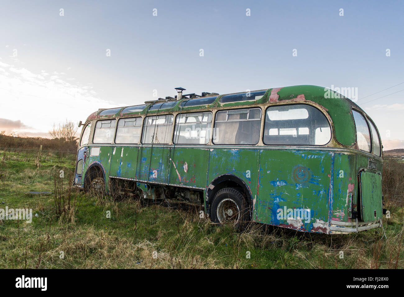 Bristol MW6G/ ECW coach from 1961 sits abandoned in a field in West Cork, Ireland with copy space Stock Photo
