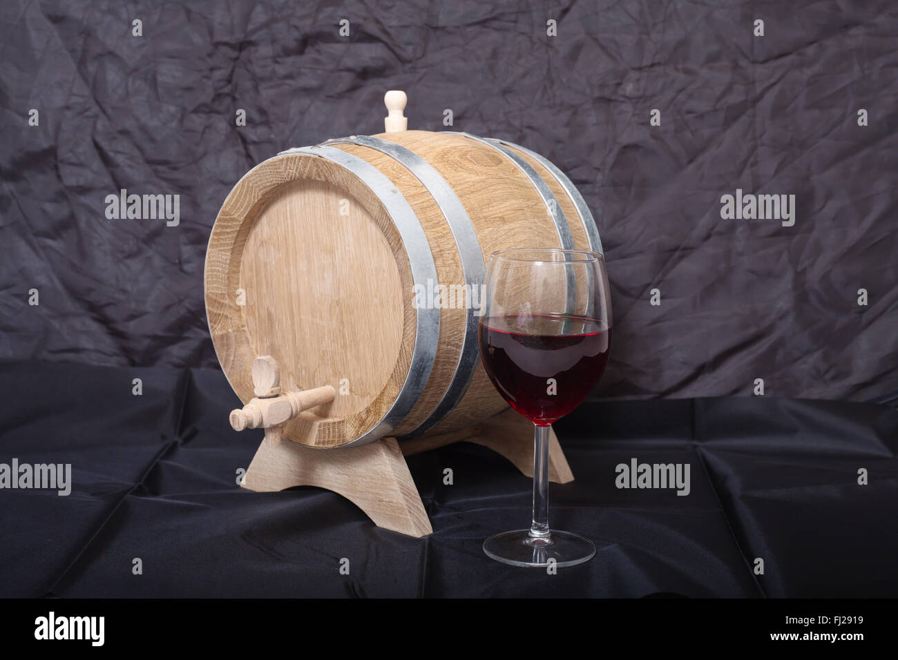 A barrel of alcohol on a black background. Stock Photo