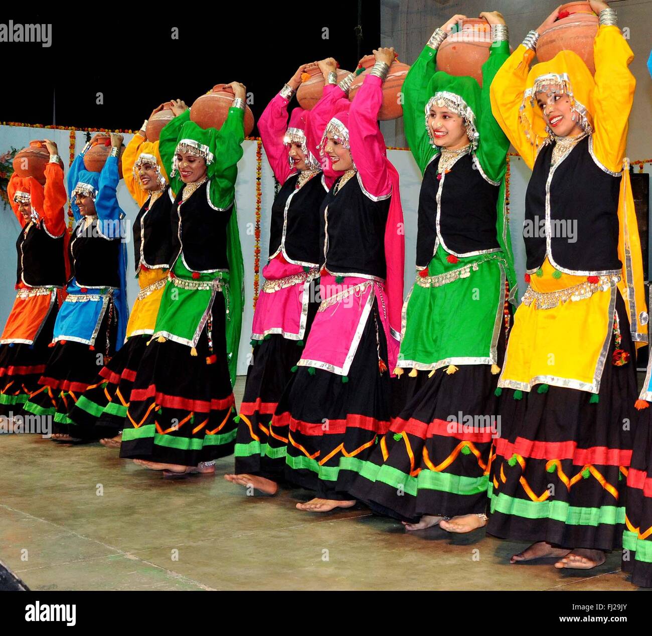 Patiala, India. 11th Feb, 2016. Girls students perform Punjabi folk dance Sammi during the Punjabi University Folk Festival at Punjabi University. Sammi Dance is a folk dance of the Punjab state of India. It originated from the tribal communities of Punjab and is performed by the women of Baazigar, Rai, Lobana and Sansi tribes. The costume of this dance is colorful and it's a treat to experience Sammi dance. The dancers usually dress themselves in bright colored kurtas and full flowing skirts called lehengas. © Rajesh Sachar/Pacific Press/Alamy Live News Stock Photo