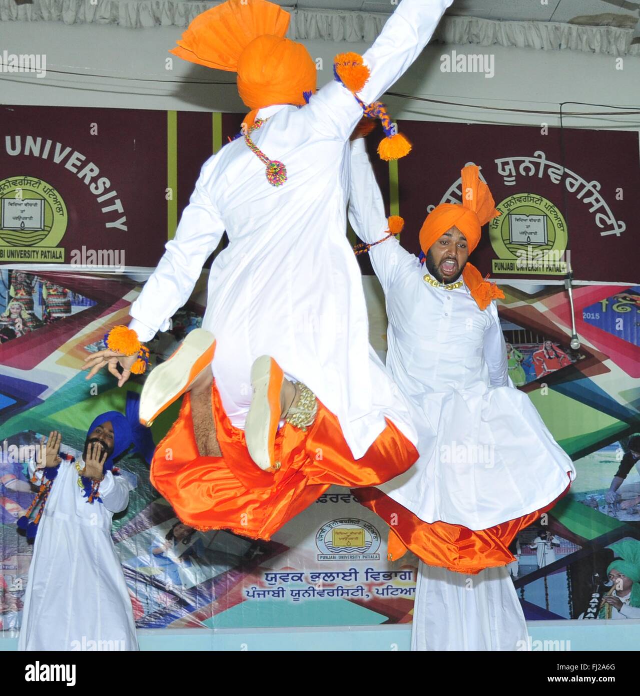 Students perform Punjabi folk and tradition dance Jhumer during the Punjabi University Inter Zonal Folk Festival at Punjabi University. This dance has originally come from Sandalbar (now in Pakistan), but is now very much a part of Punjab folk heritage. It is a dance of graceful gait, based on specific Jhumar rhythm. The Jhummar is a dance of ecstasy. It is a living testimony of the happiness of men. Any time is Jhummar timee specially during Melas (Festival), weddings and other major functions and celebrations. Performed exclusively by men, it is a common feature to see three generations“ fat Stock Photo