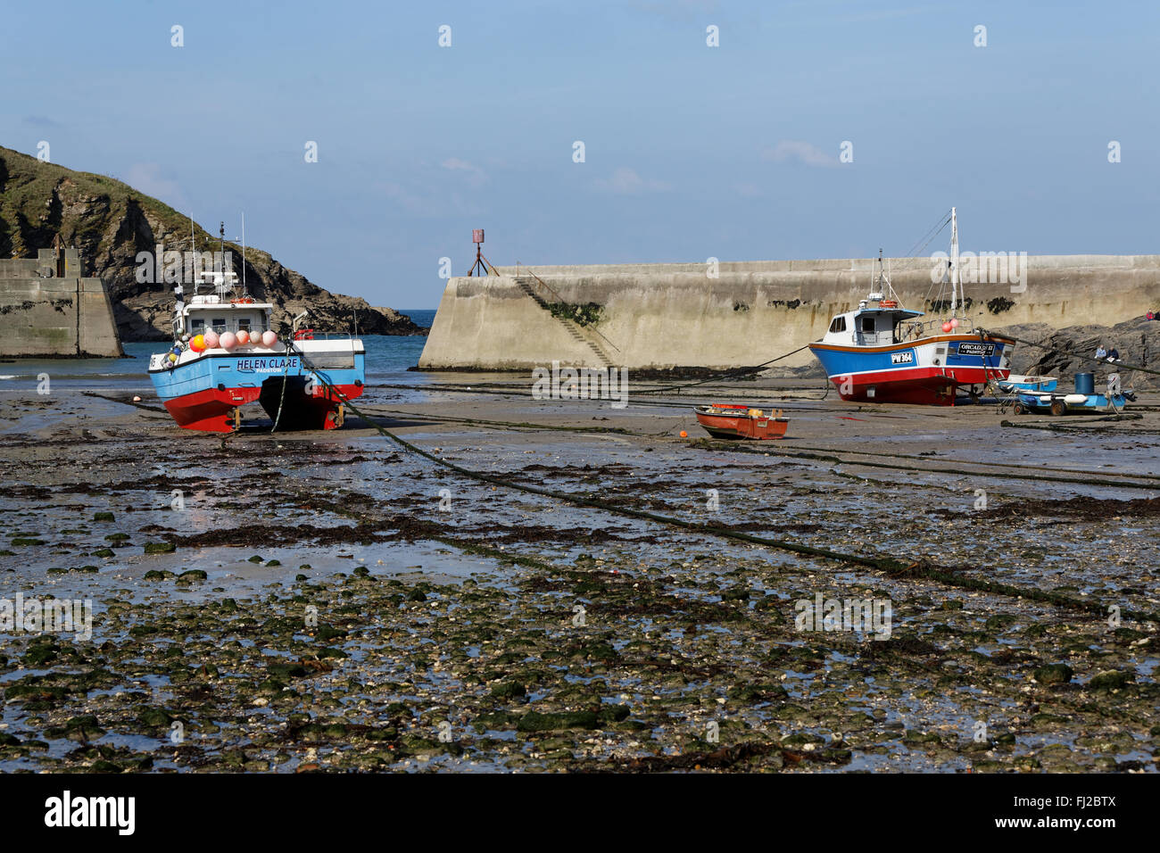 Boats at low tide in the harbor of Port Isaac, Cornwall, UK. Stock Photo