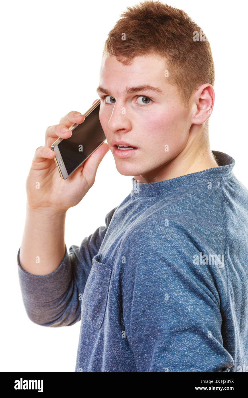 Technology and communication. Young man casual style talking on mobile ...