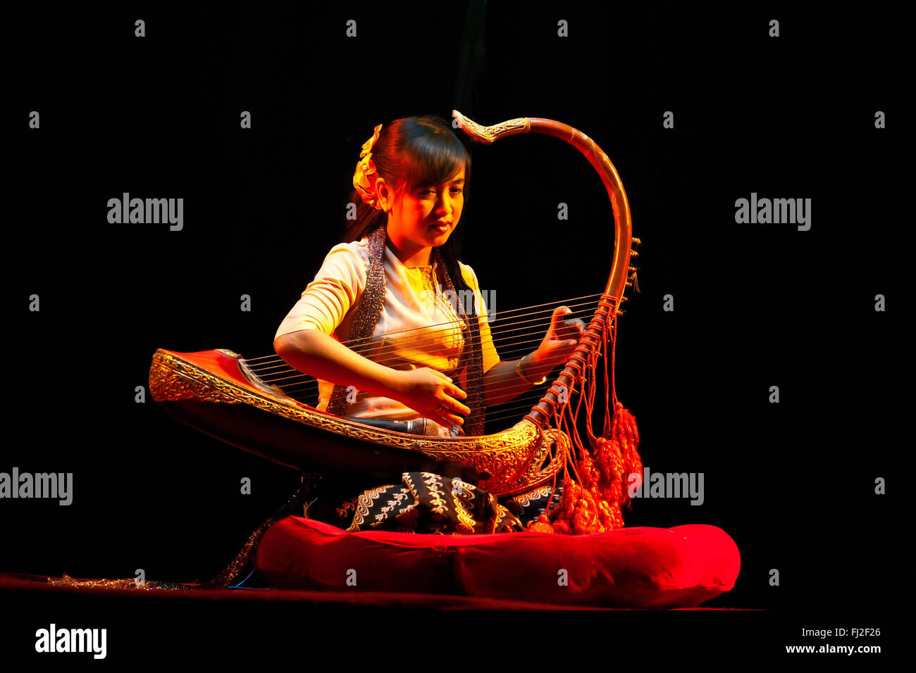 Traditional HARP MUSIC is performed at the MANDALAY MARIONETTES THEATER - MANDALAY, MYANMAR Stock Photo