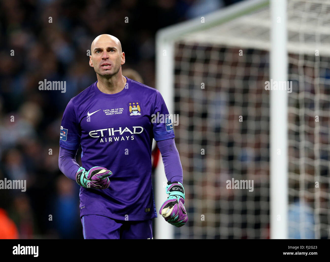 London, UK. 28th Feb, 2016. Manchester City goalkeeper Willy Caballero celebrates after saving a penalty kick during the League Cup final between Liverpool and Manchester City at Wembley Stadium in London, Britain on Feb. 28, 2016. Manchester City beat Liverpool on penalties to win the League Cup. Credit:  Han Yan/Xinhua/Alamy Live News Stock Photo