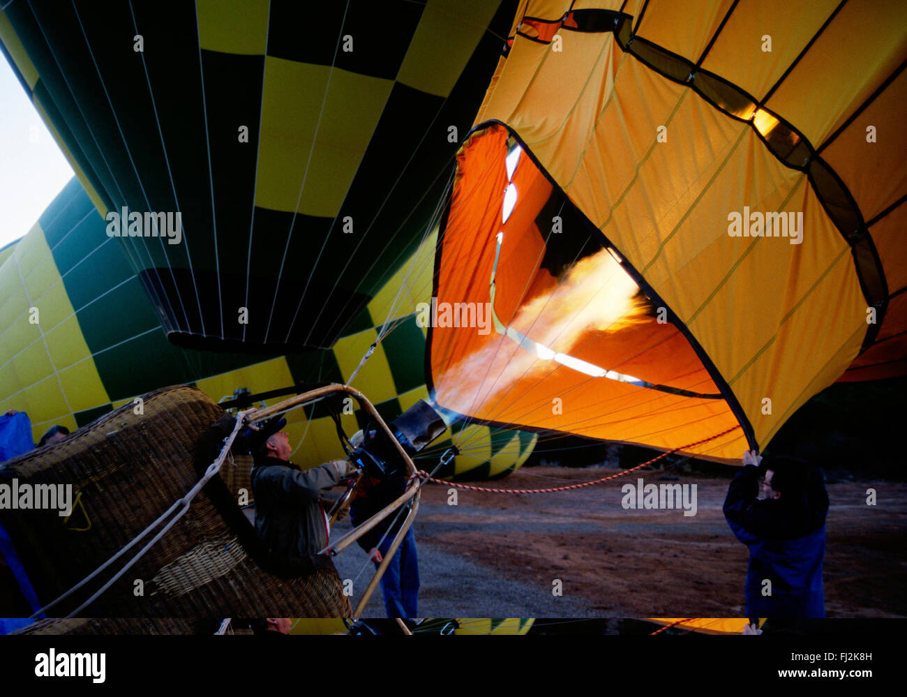 Inflating a HOT AIR BALLOON for an early morning ride provided by NORTHERN LIGHT BALLOON EXP. - SEDONA, ARIZONA Stock Photo