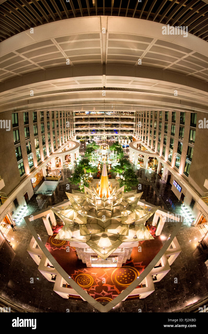 BANGKOK, Thailand — The opulent interior of the Novotel Suvarnabhumi Airport hotel in Bangkok, where modern design meets traditional Thai elements. Its strategic location and luxurious facilities make it a popular choice for travelers transiting through or staying near the bustling Suvarnabhumi Airport. Stock Photo