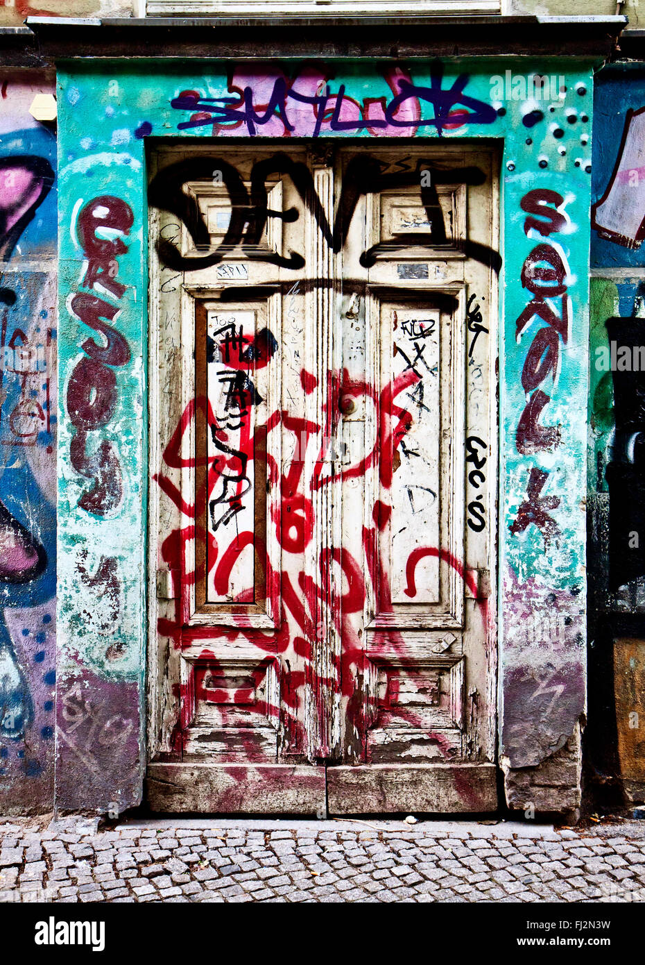 Berlin, Germany - building entrance covered by graffiti Stock Photo - Alamy