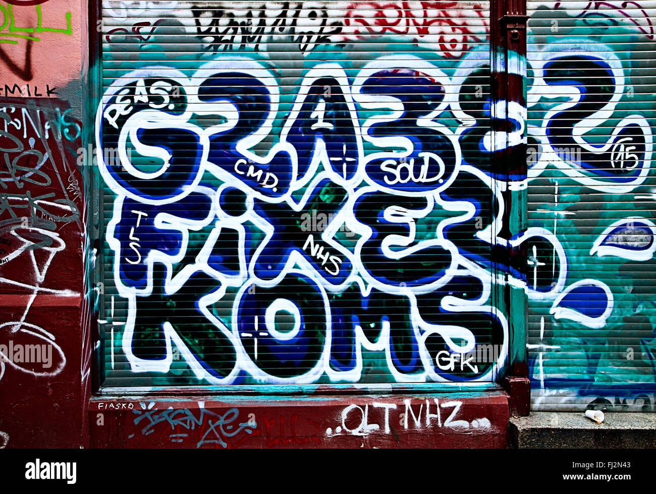 Berlin, roller blind of store with street art graffiti Stock Photo - Alamy