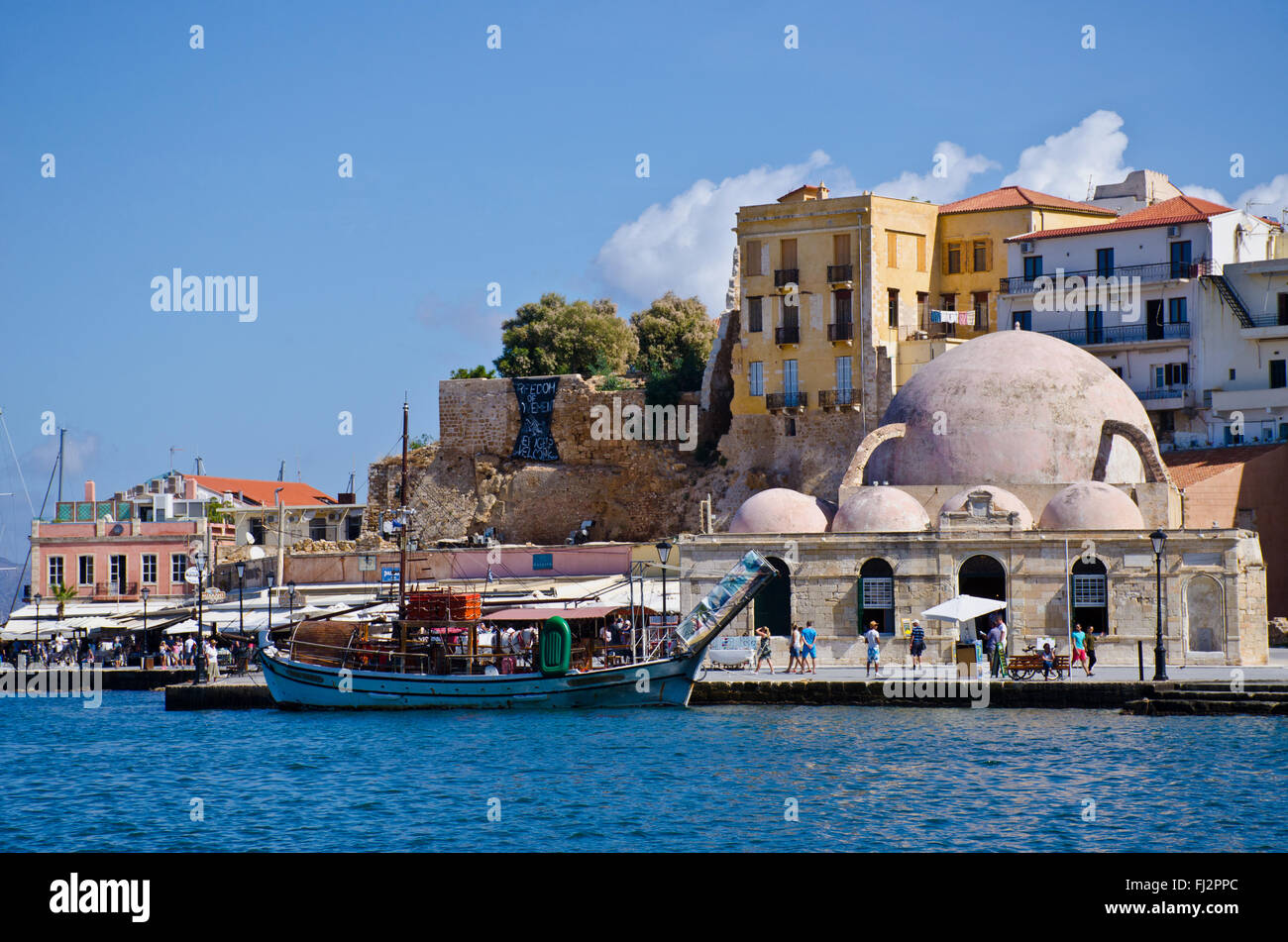 Küzük Hasan Pasha mosque at Chania harbor,  Crete, Greece Stock Photo