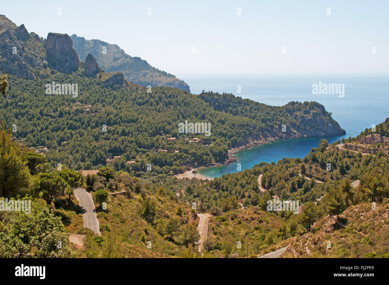 Mallorca, Balearic Islands, Spain: the winding road leading in Cala Tuent, a remote beach at the foot of the mountain range of the Serra de Tramuntana Stock Photo