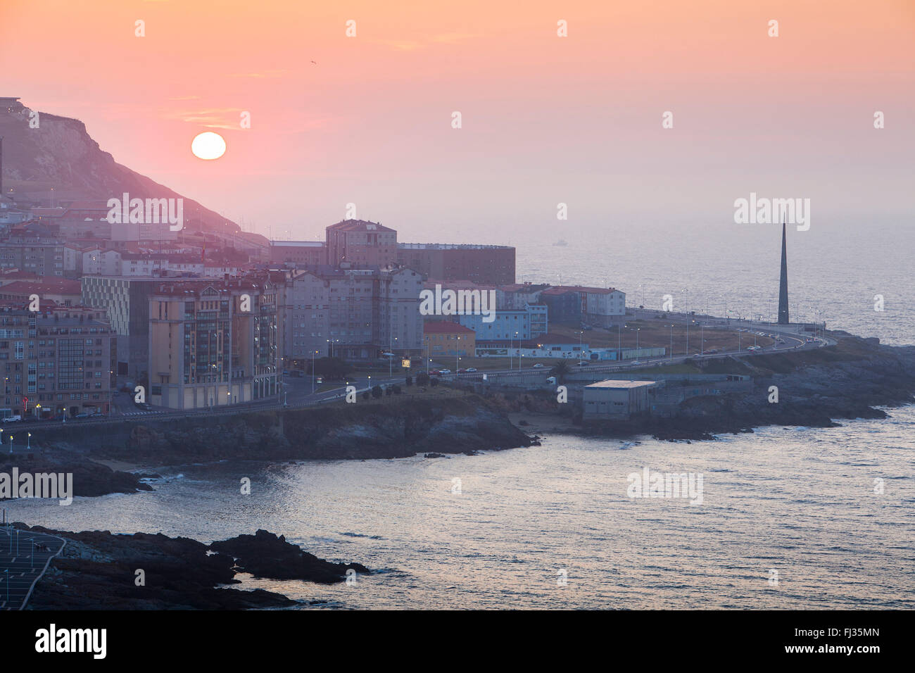 View of the city, at right Millennium obelisk, Coruña city, Galicia, Spain Stock Photo