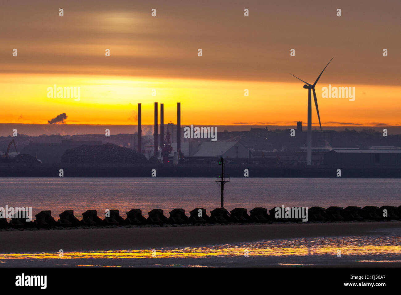 New Brighton, Wallasey.  29th February 2016. UK Weather. Sunrise over the River Mersey. New Brighton is a seaside resort forming part of the town of Wallasey, in the Metropolitan Borough of Wirral, in the metropolitan county of Merseyside, England. It is located at the northeastern tip of the Wirral Peninsula, within the historic county boundaries of Cheshire, and has sandy beaches which line the Irish Sea. New Brighton is home to the UK's longest promenade at 3.5 kilometres. Stock Photo