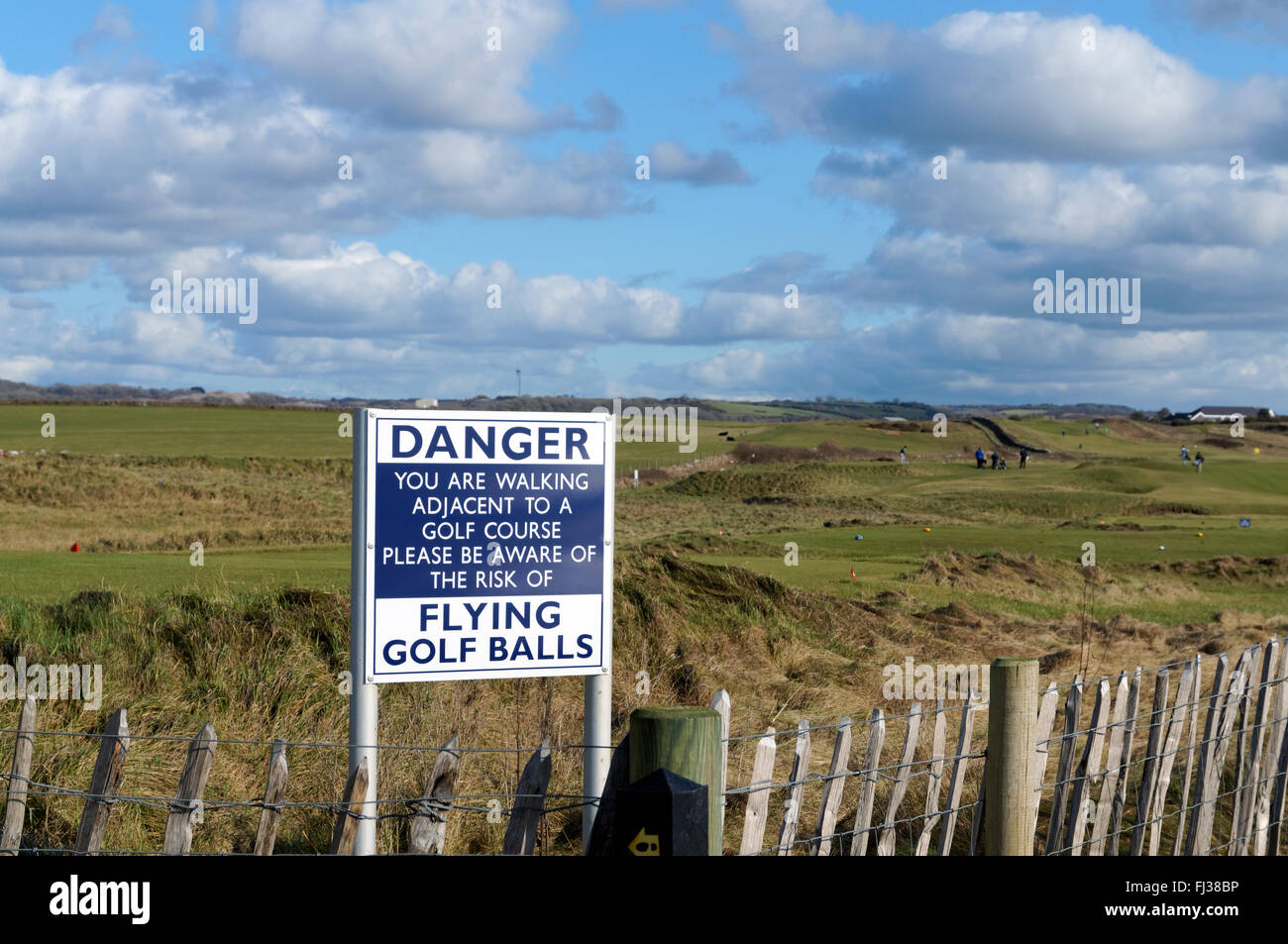 Danger sign besides Royal Porthcawl Golf Course, Porthcawl, South Wales, UK. Stock Photo
