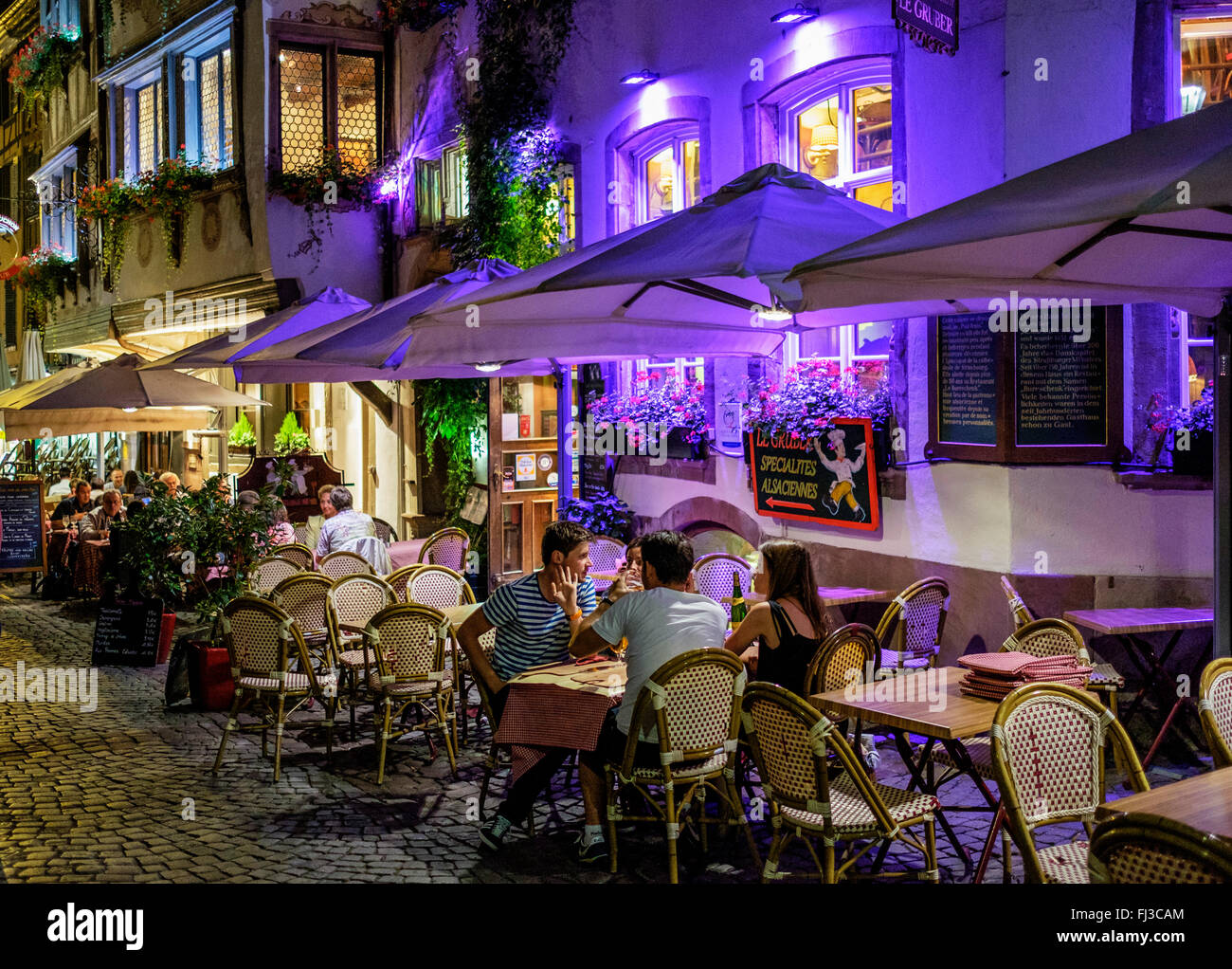 Restaurant street terrace at night, Strasbourg, Alsace, France Stock Photo