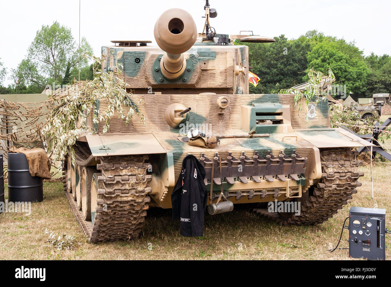 Second world was re-enactment. Front view of German Tiger tank in green and brown camouflage pattern, with 88mm gun. Stock Photo
