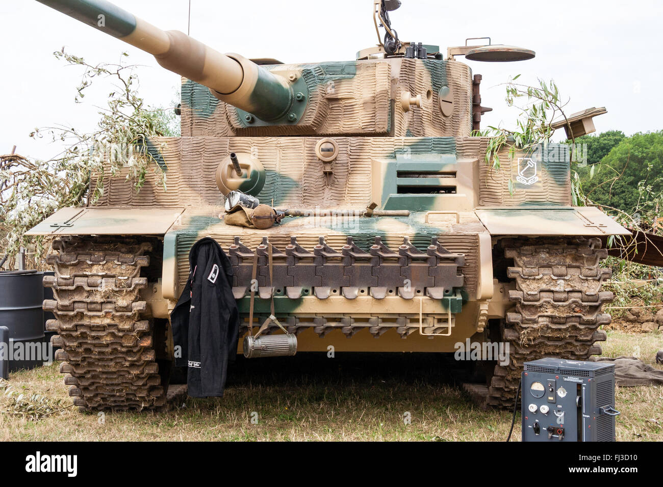 Second world was re-enactment. Front view of German Tiger tank in green and brown camouflage pattern, with 88mm gun. Stock Photo