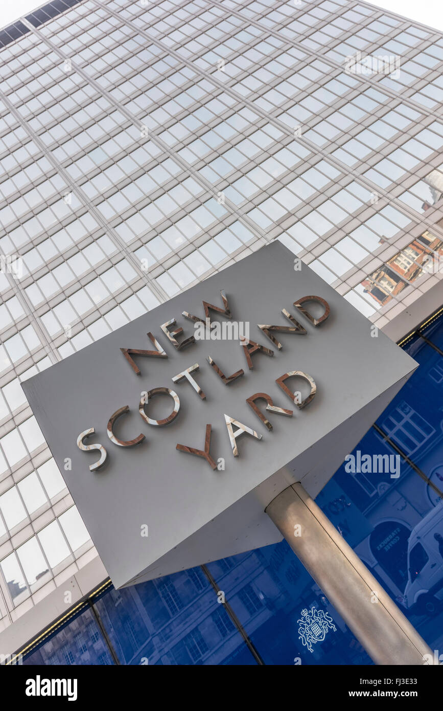 This triangular, revolving, sign stands outside New Scotland Yard which is the headquarters of the Metropolitan Police Service. Stock Photo