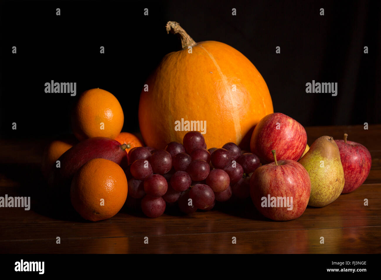variety of fruits on a wooden table, studio picture Stock Photo - Alamy