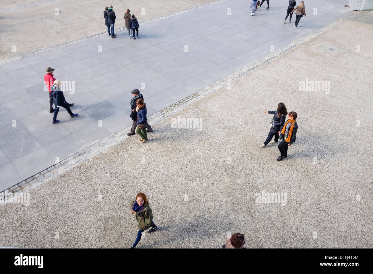 People on square, pedestrians, walking viewed from above, high view. Stock Photo