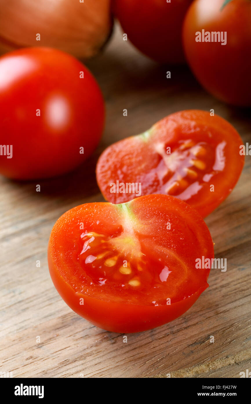 red tomatoes close-up on a cutting board Stock Photo - Alamy