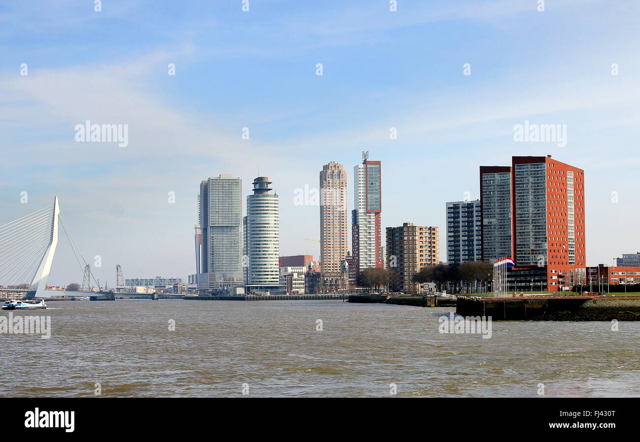 Skyline of Rotterdam, Netherlands. Nieuwe Maas river with high-rise buildings. Erasmus bridge connecting city centre with south Stock Photo