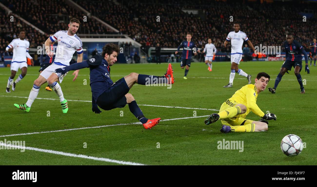 Maxwell of PSG goes flying after being denied by Chelsea’s keeper Thibaut Courtois during the UEFA Champions League round of 16 match between Paris Saint-Germain and Chelsea at the Parc des Princes Stadium in Paris. February 16, 2016. James Boardman / Telephoto Images +44 7967 642437 Stock Photo