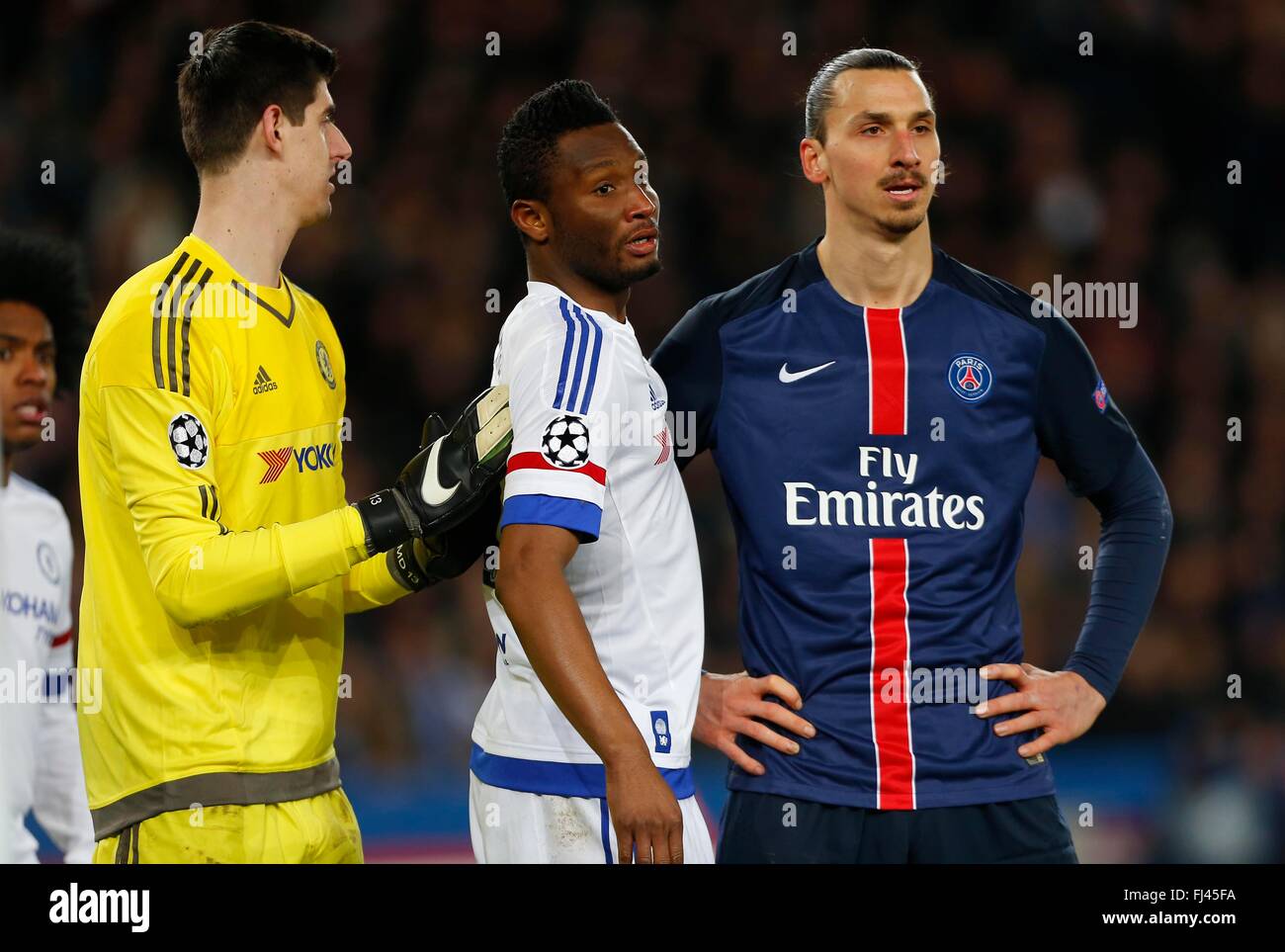 Chelsea’s keeper Thibaut Courtois,  Mikel John Obi and Zlatan Ibrahimovic of PSG seen during the UEFA Champions League round of 16 match between Paris Saint-Germain and Chelsea at the Parc des Princes Stadium in Paris. February 16, 2016. James Boardman / Telephoto Images +44 7967 642437 Stock Photo