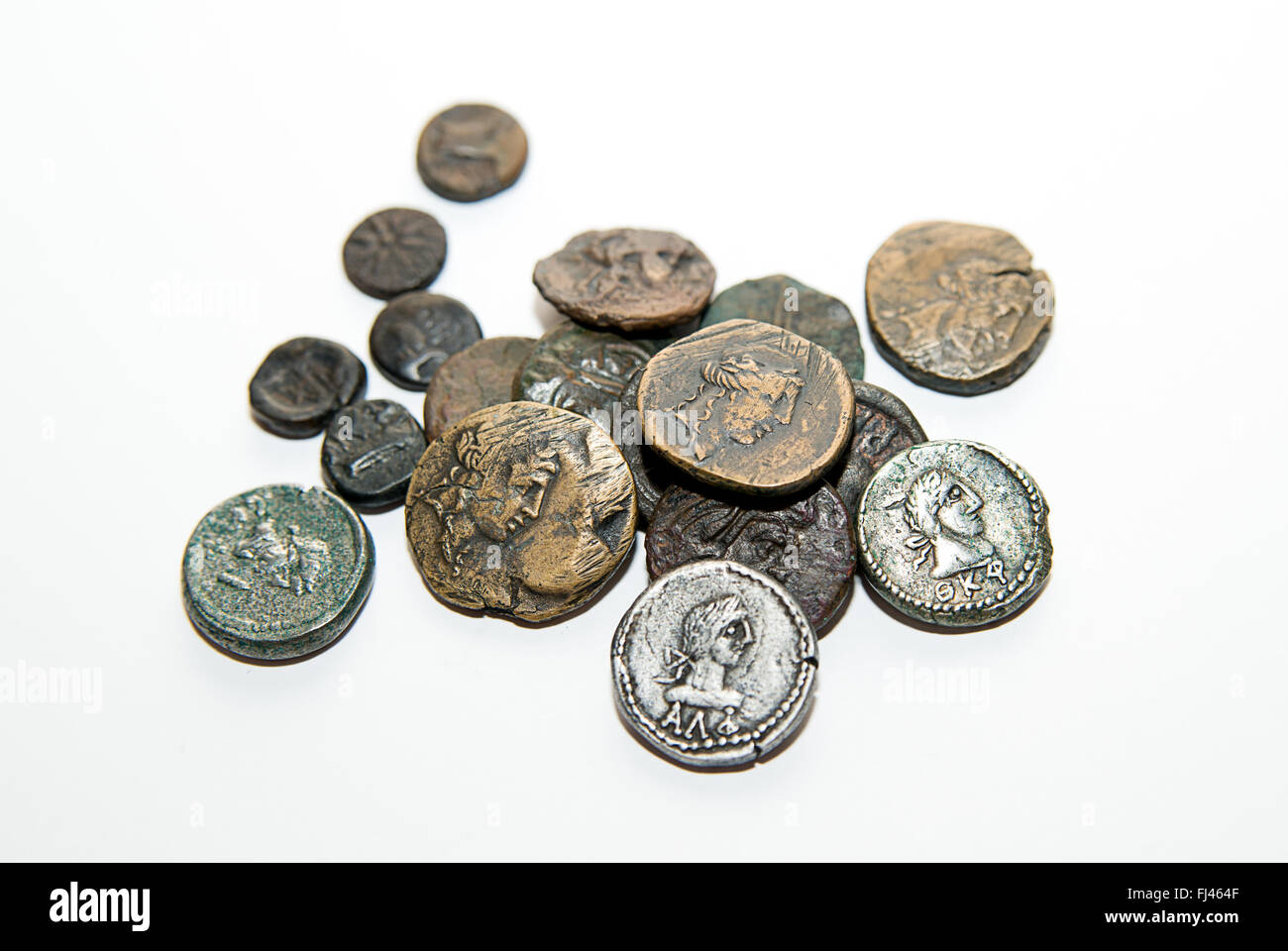 A lot of old  coins with portraits of kings on a white background Stock Photo
