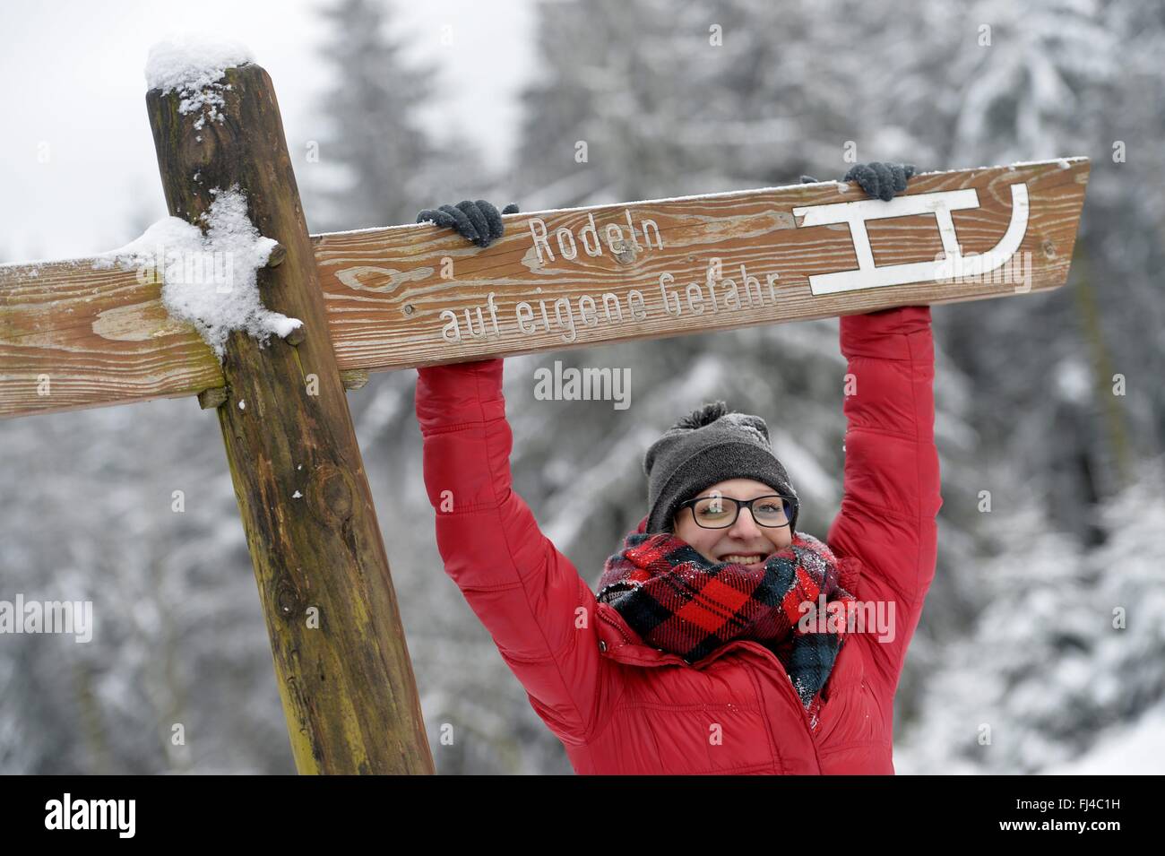 A young woman in the snow, Germany, city of Sonnenberg, 18. February 2016. Photo: Frank May Stock Photo
