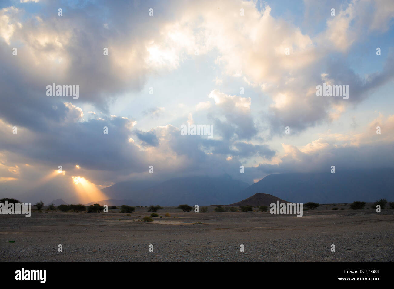 Sunrise near Nakhl, cloudy sunrise in the omani desert, Nakhl, Al Batinah, Oman Stock Photo
