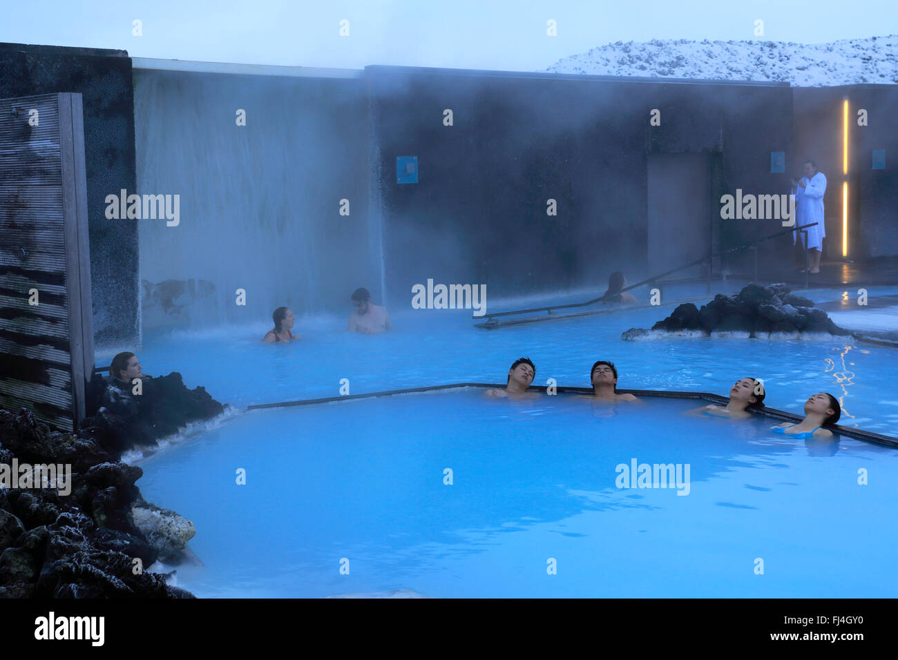 People in the Blue Lagoon, a geothermal spa and one of the most popular attractions in Iceland, near Grindavík village Reykjanes Stock Photo