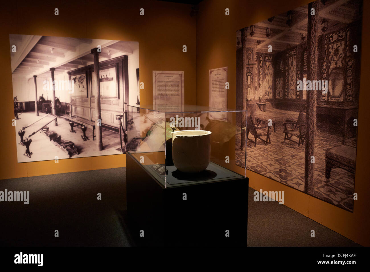 A visitor looks at authentic objects from the Titanic at the exhibition ...
