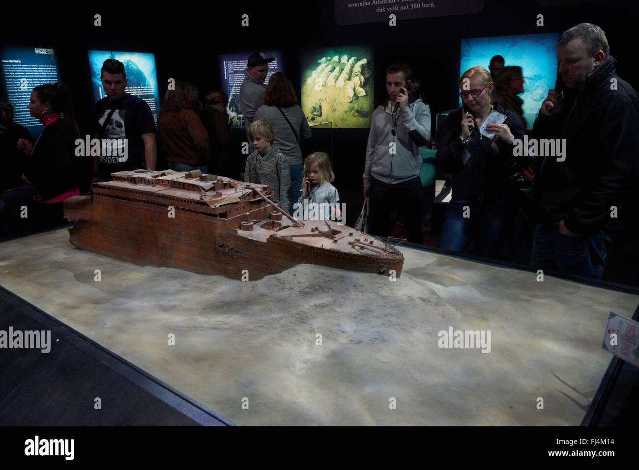 A visitor looks at authentic objects from the Titanic at the exhibition ...