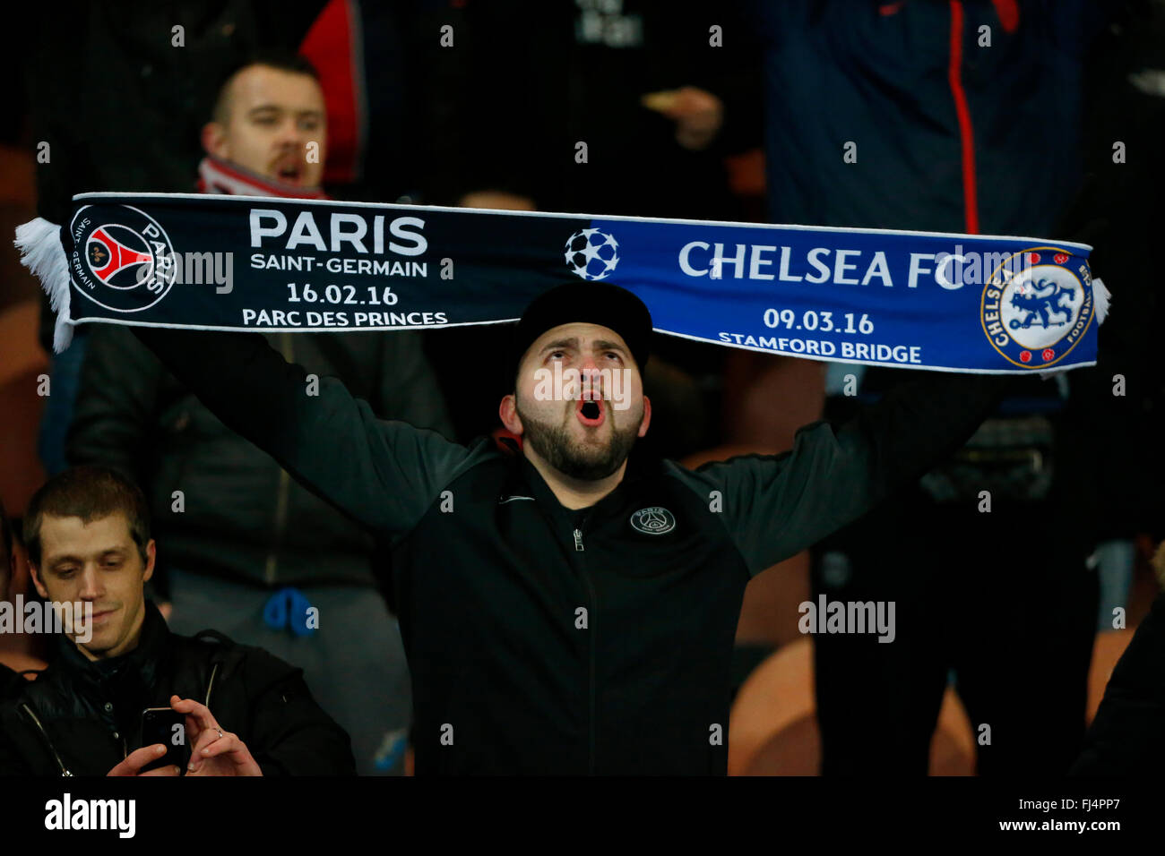 PSG fans singing during the UEFA Champions League round of 16 match between Paris Saint-Germain and Chelsea at the Parc des Princes Stadium in Paris. February 16, 2016. James Boardman / Telephoto Images +44 7967 642437 Stock Photo