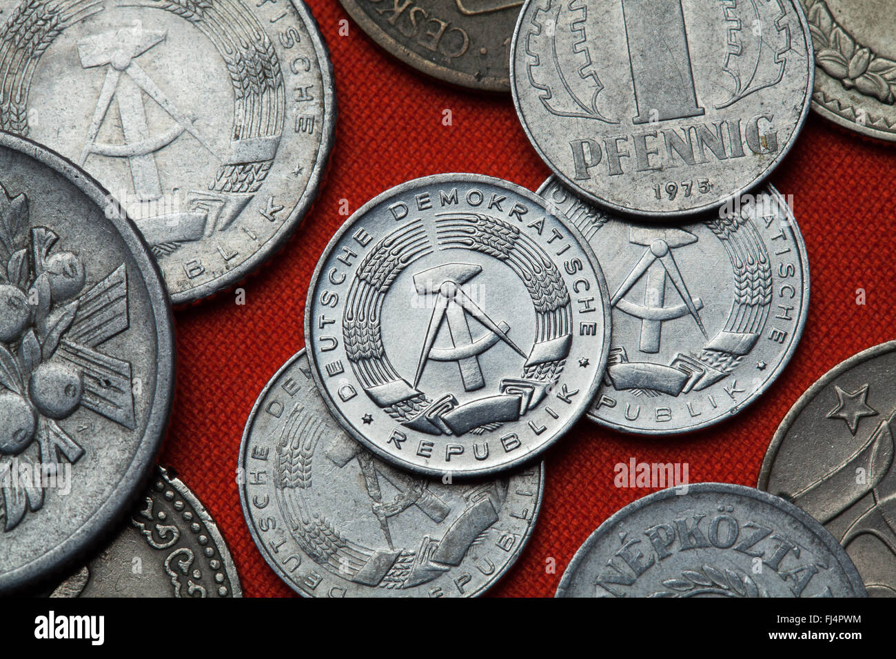 Coins of East Germany. Coat of arms of the German Democratic Republic depicted in the East German one pfennig coin (1968). Stock Photo