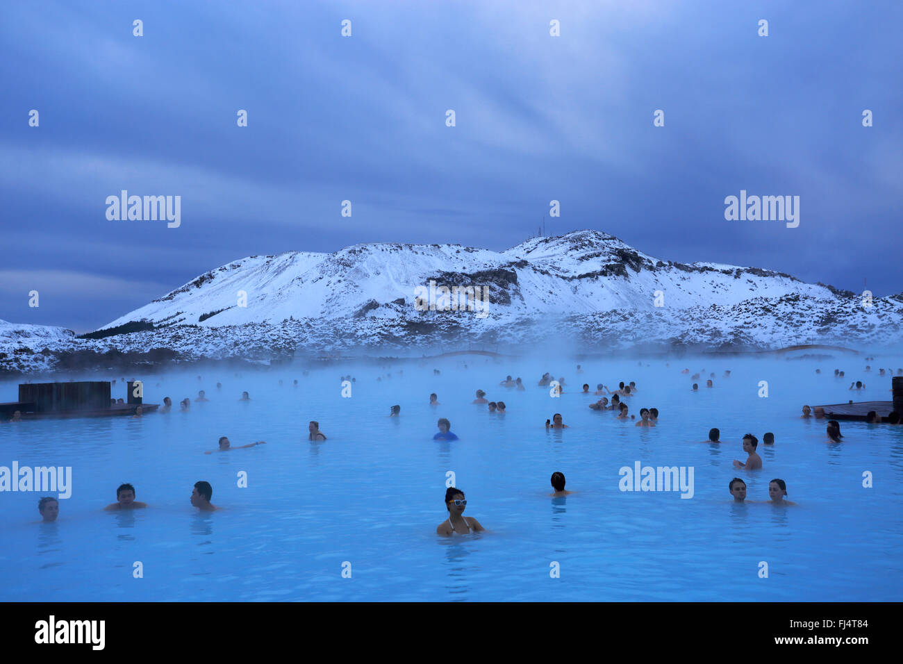 People in the Blue Lagoon, a geothermal spa and one of the most popular attractions in Iceland, near Grindavík village Reykjanes Stock Photo