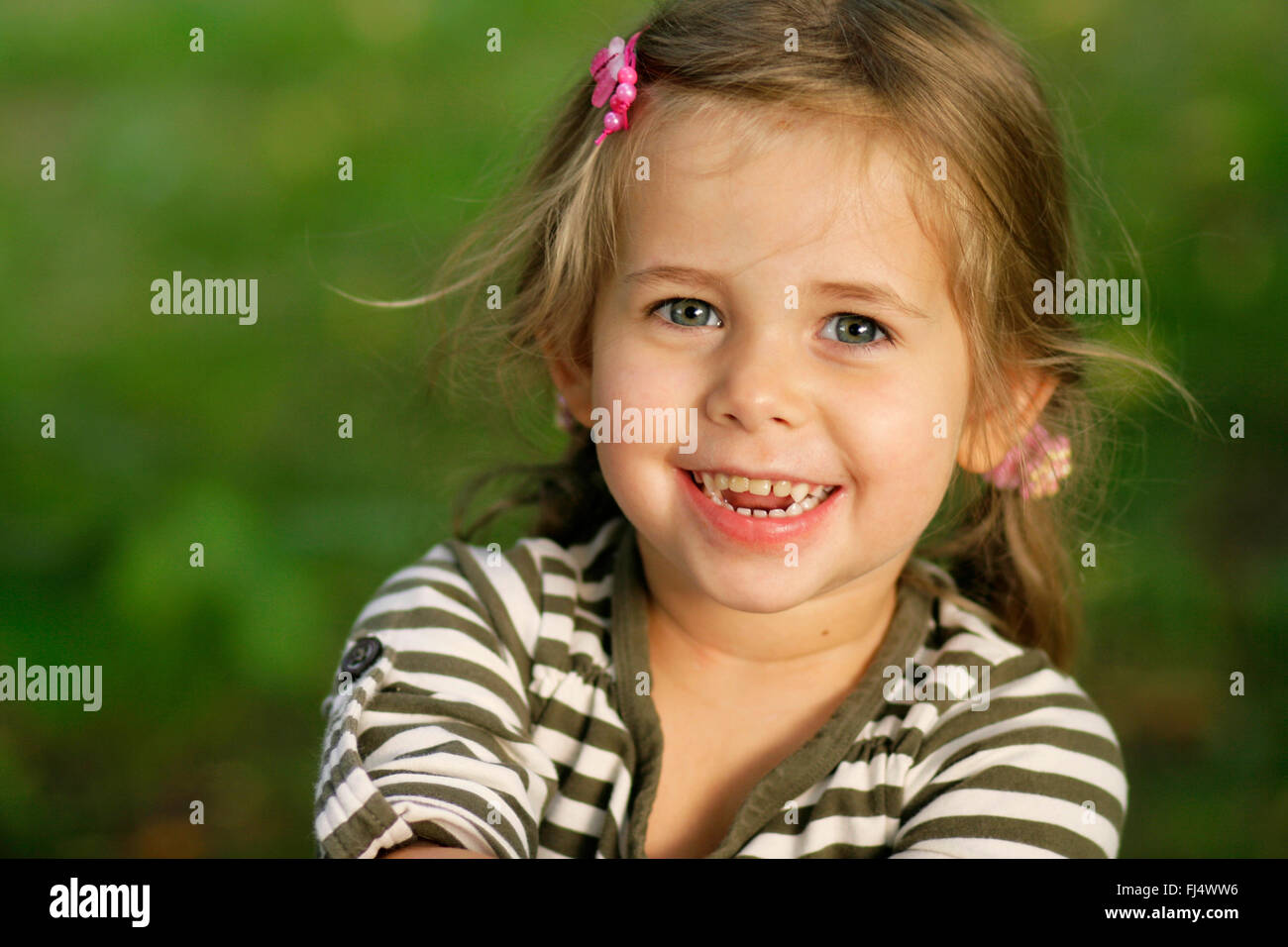 happy little girl in a meadow, portrait, Germany Stock Photo